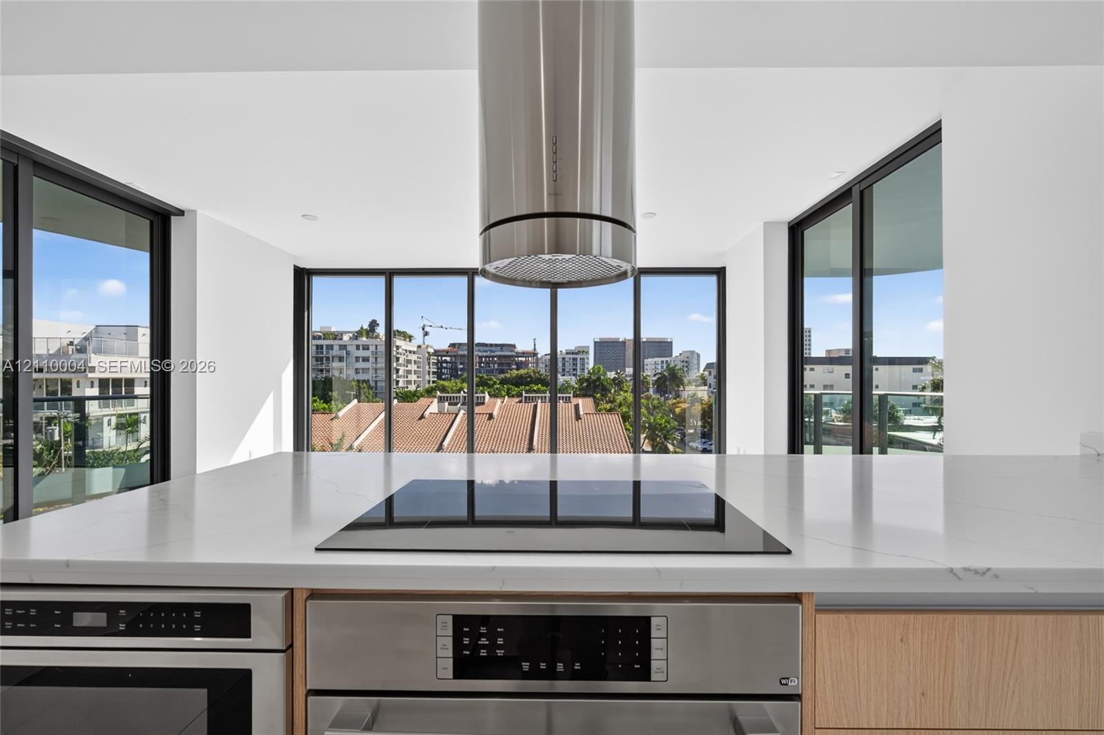 Kitchen featuring a stone-surface island