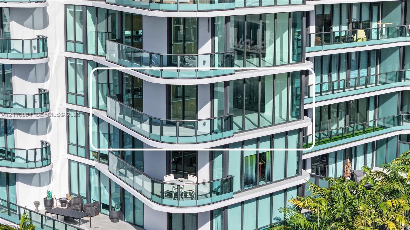 High-rise exterior featuring floor-to-ceiling glass windows