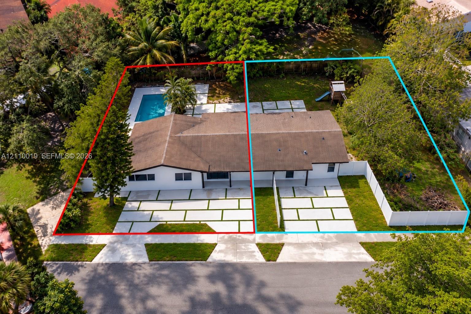 Aerial perspective of two properties featuring concrete paver driveways with grass inlay, rectangular in-ground pool, white vinyl fencing, and mature landscaping