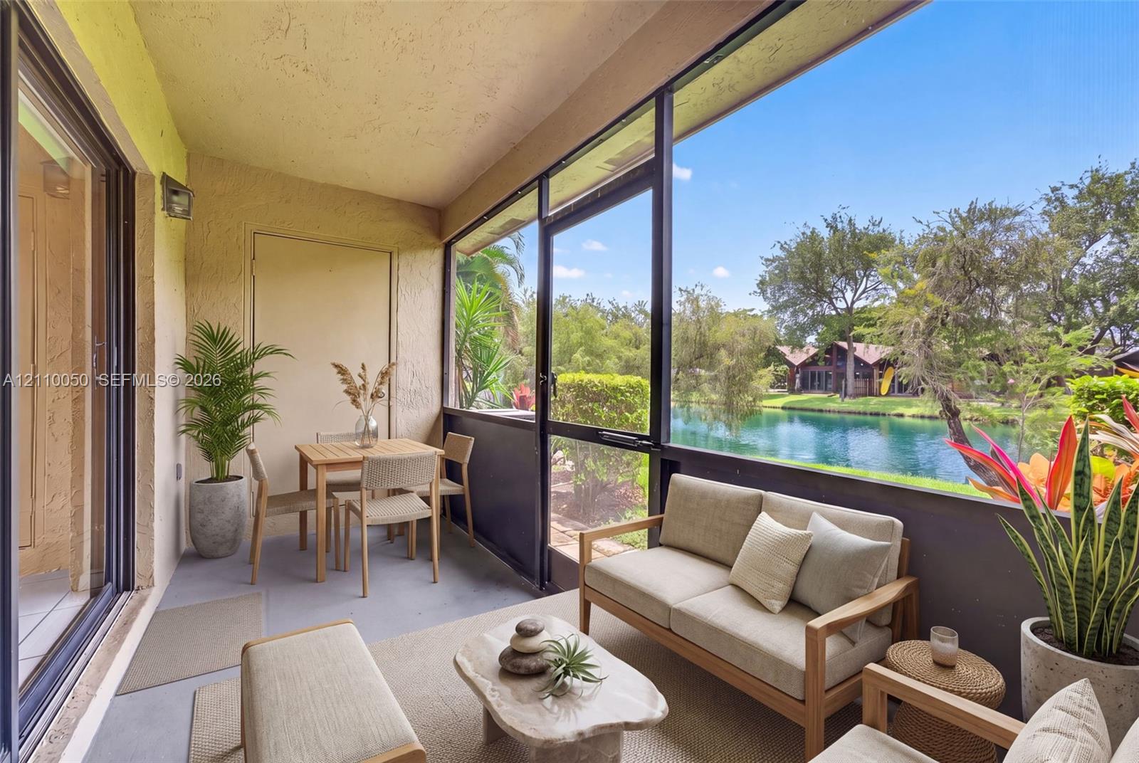 Screened-in lanai featuring concrete flooring and aluminum framing, virtually staged