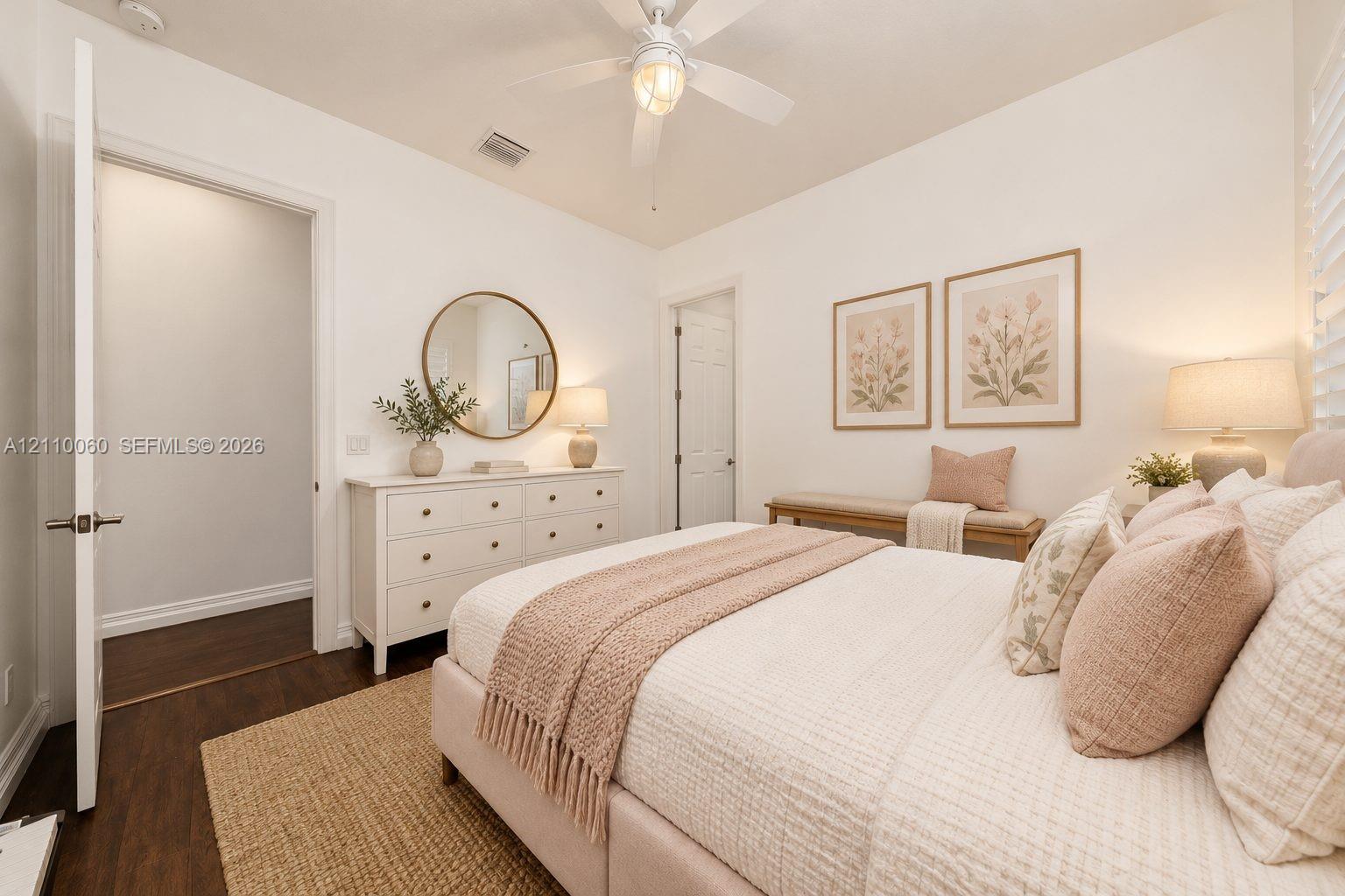 Virtually staged. Wood-finish flooring, ceiling fan with integrated lighting, and neutral wall tones