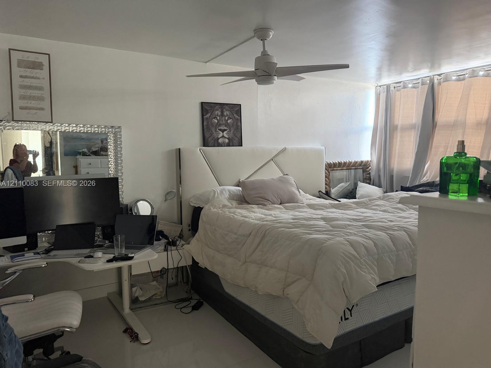 White ceiling fan with integrated lighting and multi-pane windows