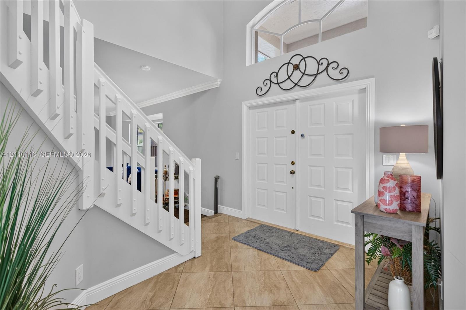 Foyer featuring high ceilings, double entry doors Foyer featuring high ceilings, double entry doors