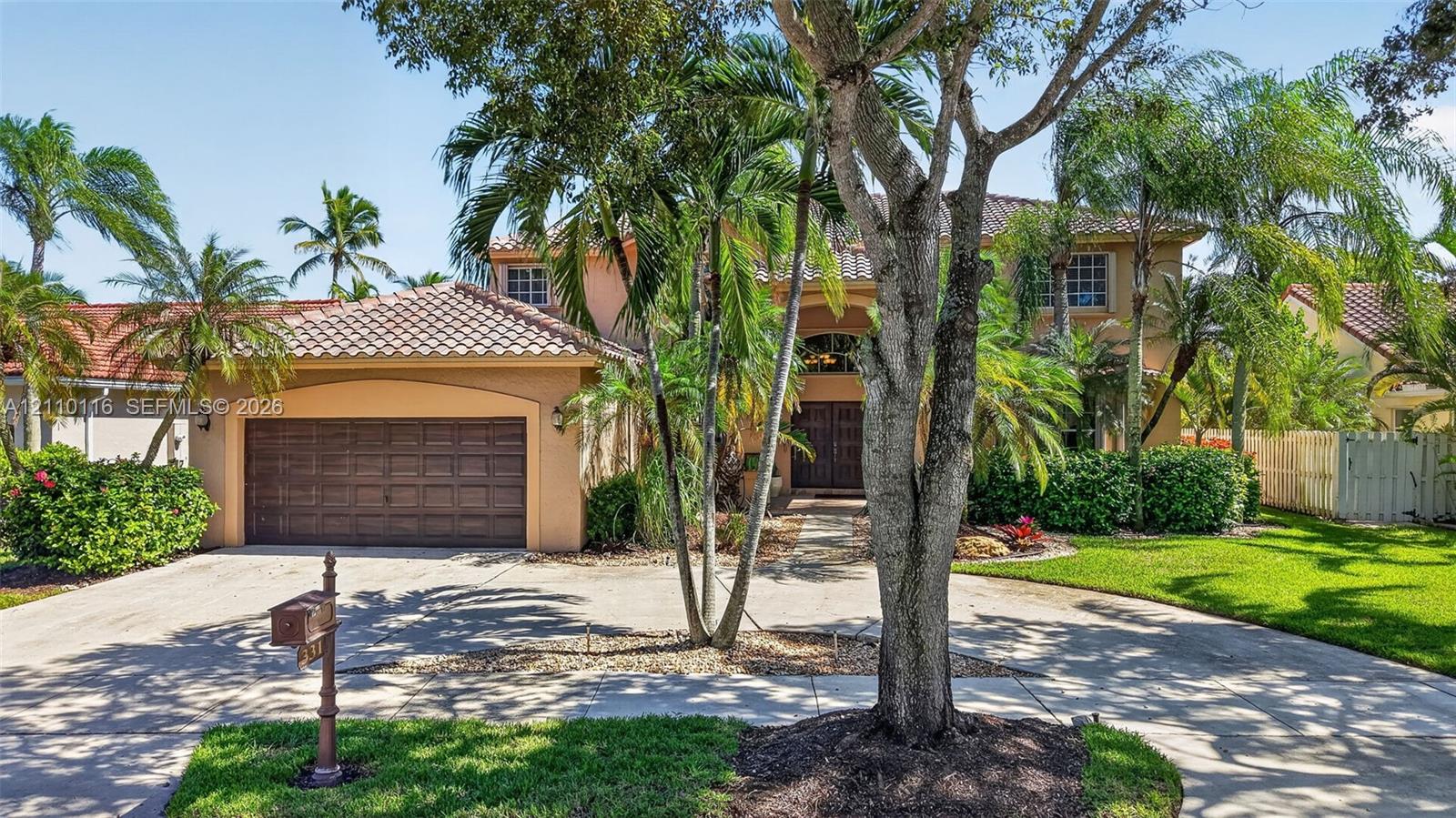 BRAND NEW tile roof, arched entryway, and 2-car garage circular driveway BRAND NEW tile roof, arched entryway, and 2-car garage circular driveway