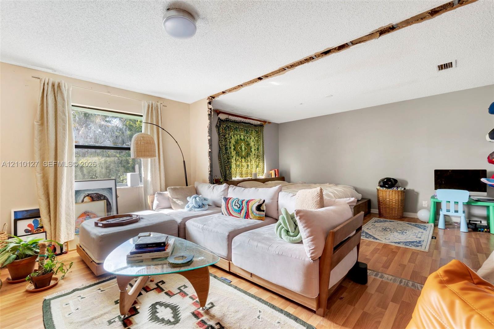 Wood-finish flooring and a single-pane window