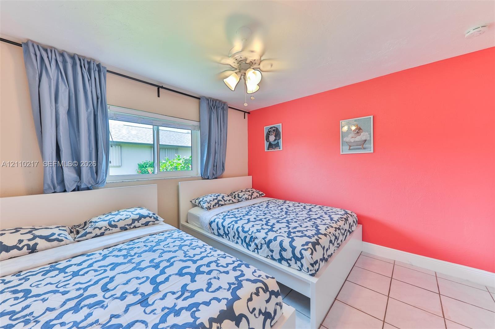 Tile flooring, white-finish ceiling fan with integrated lighting, and horizontal sliding window