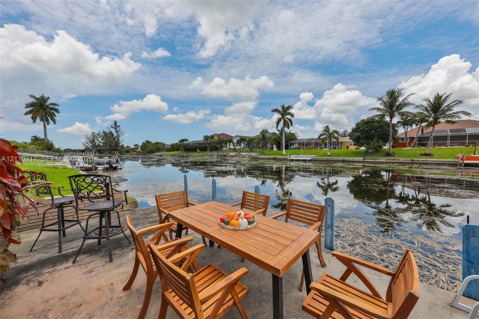 Waterfront concrete terrace featuring direct canal access and expansive water scenery