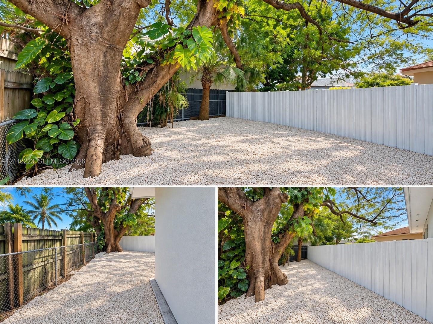 Exterior Property Documentation. Overview of the ground-level landscaping and perimeter fencing surrounding the property