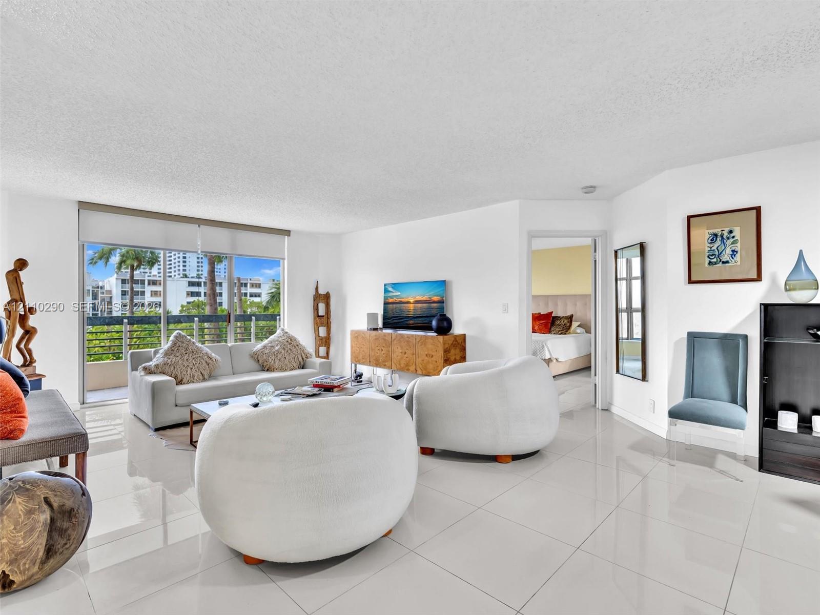 Spacious Living Area with Pool and Intracoastal Views and Updated Flooring