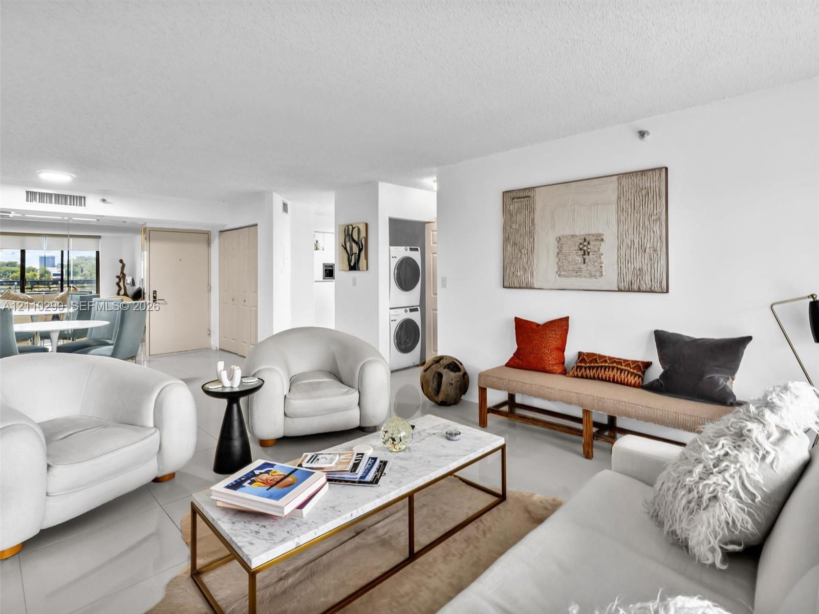 Spacious Living Area with Pool and Intracoastal Views and Updated Flooring