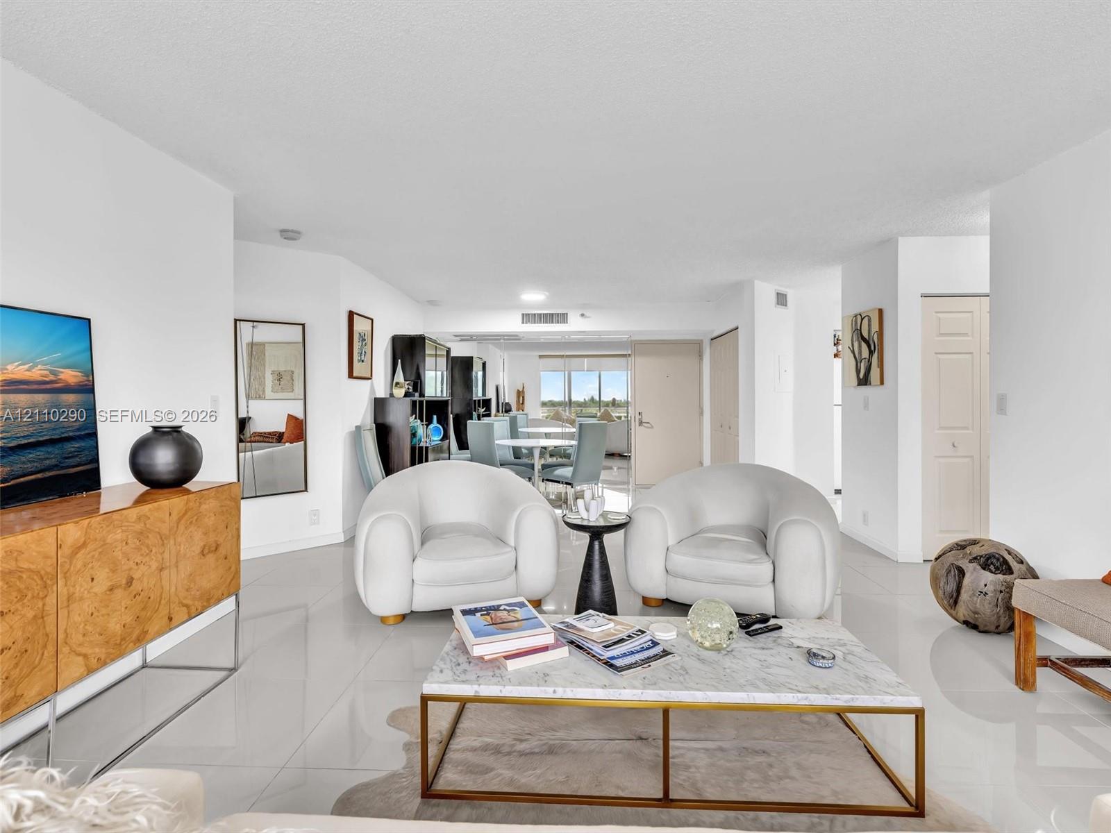 Spacious Living Area with Pool and Intracoastal Views and Updated Flooring