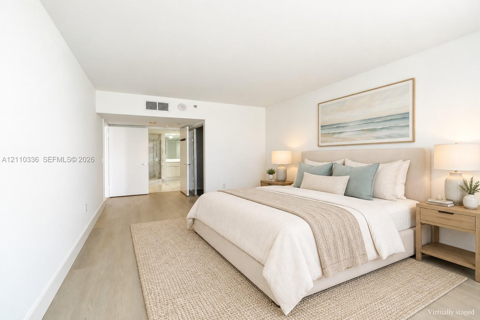 Spacious interior featuring light-toned wood-finish flooring and neutral wall finishes
