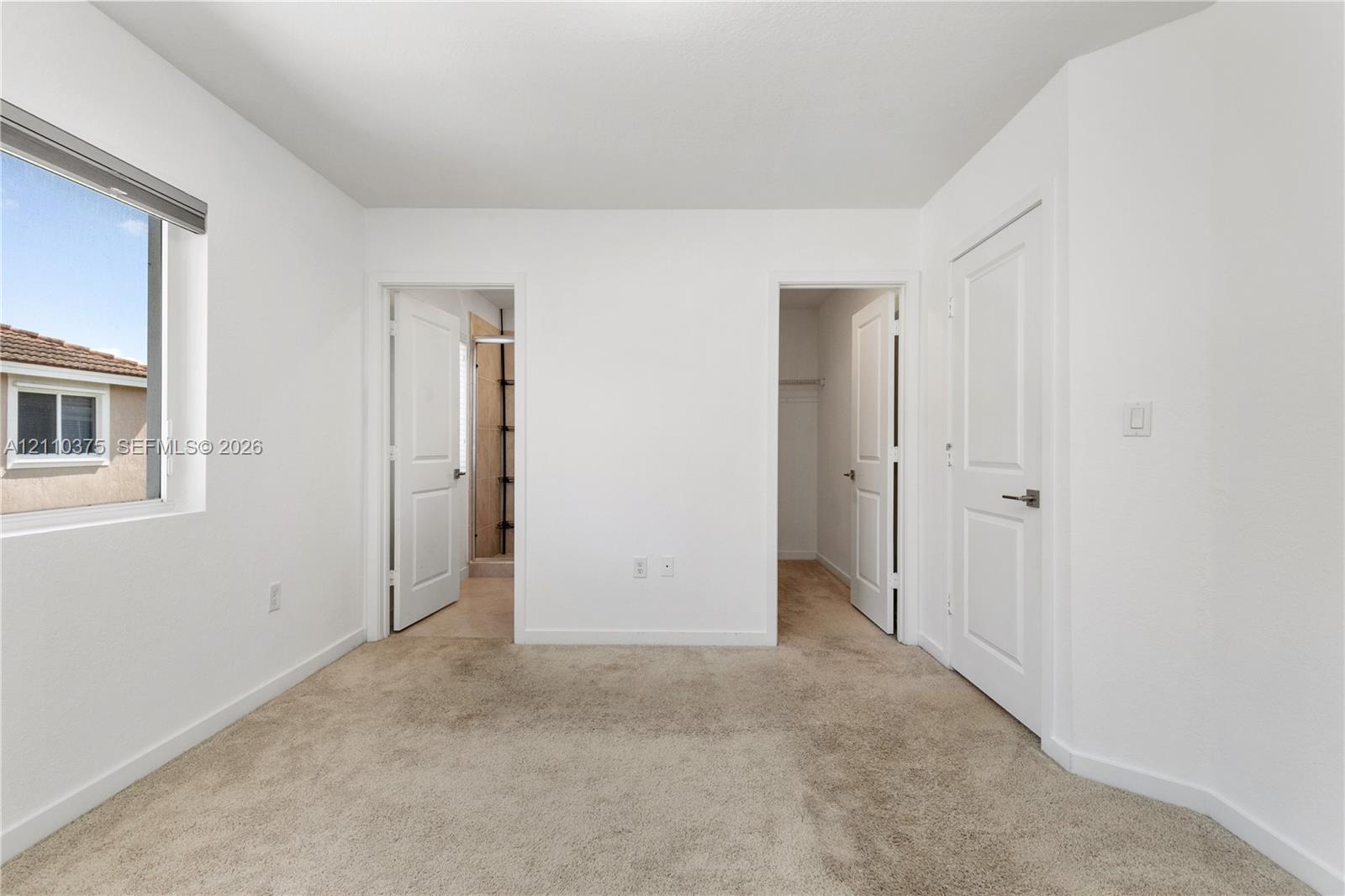 Master Bedroom, entry to Bathroom and Walk in Closet