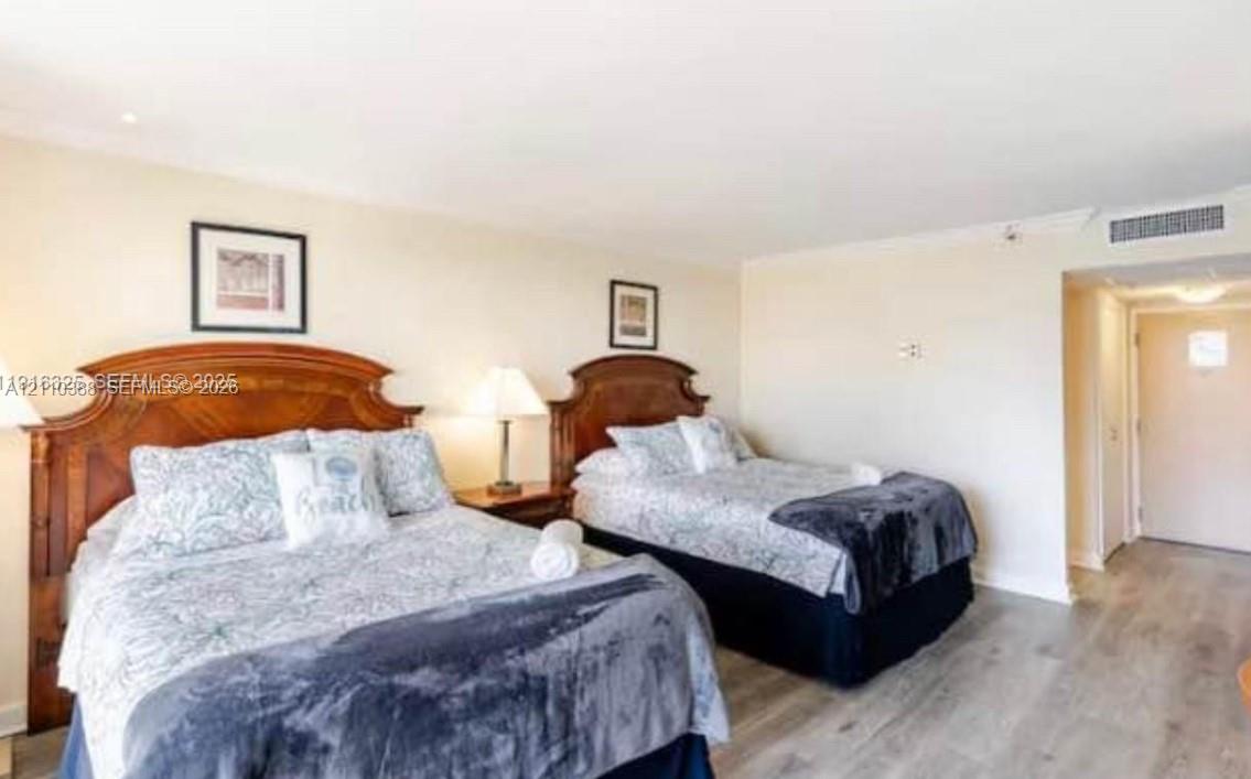 Neutral wall paint, wood-finish flooring, and recessed ceiling lighting Neutral wall paint, wood-finish flooring, and recessed ceiling lighting