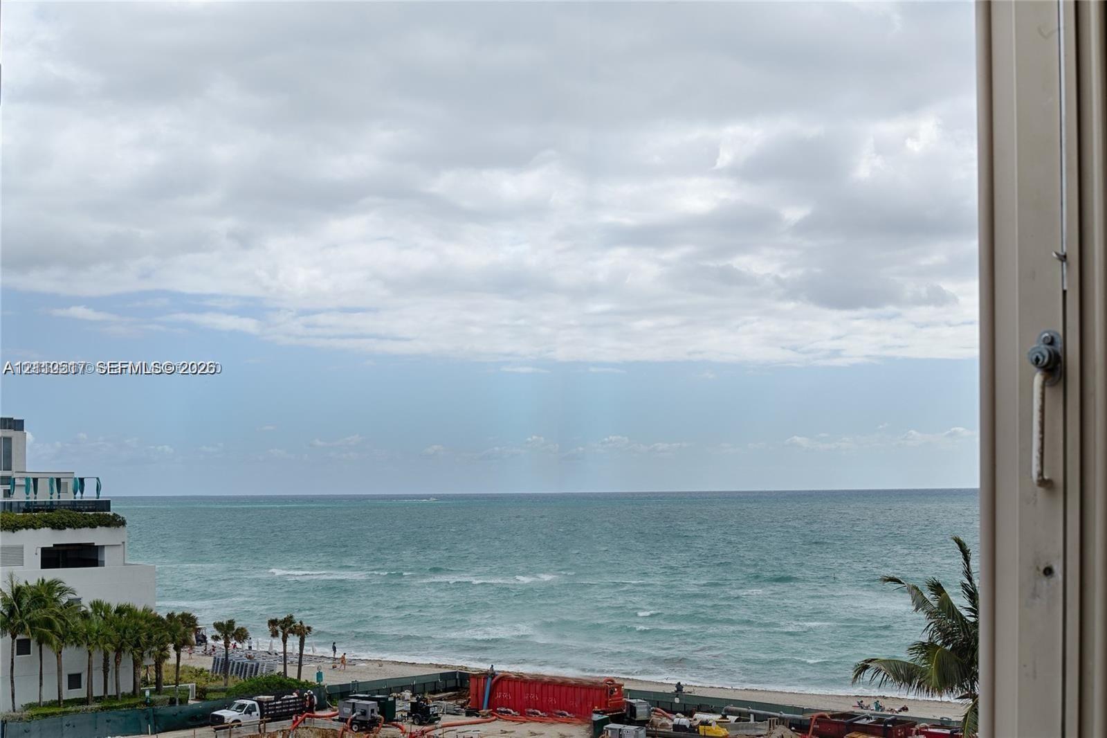 Expansive ocean horizon and sandy shoreline