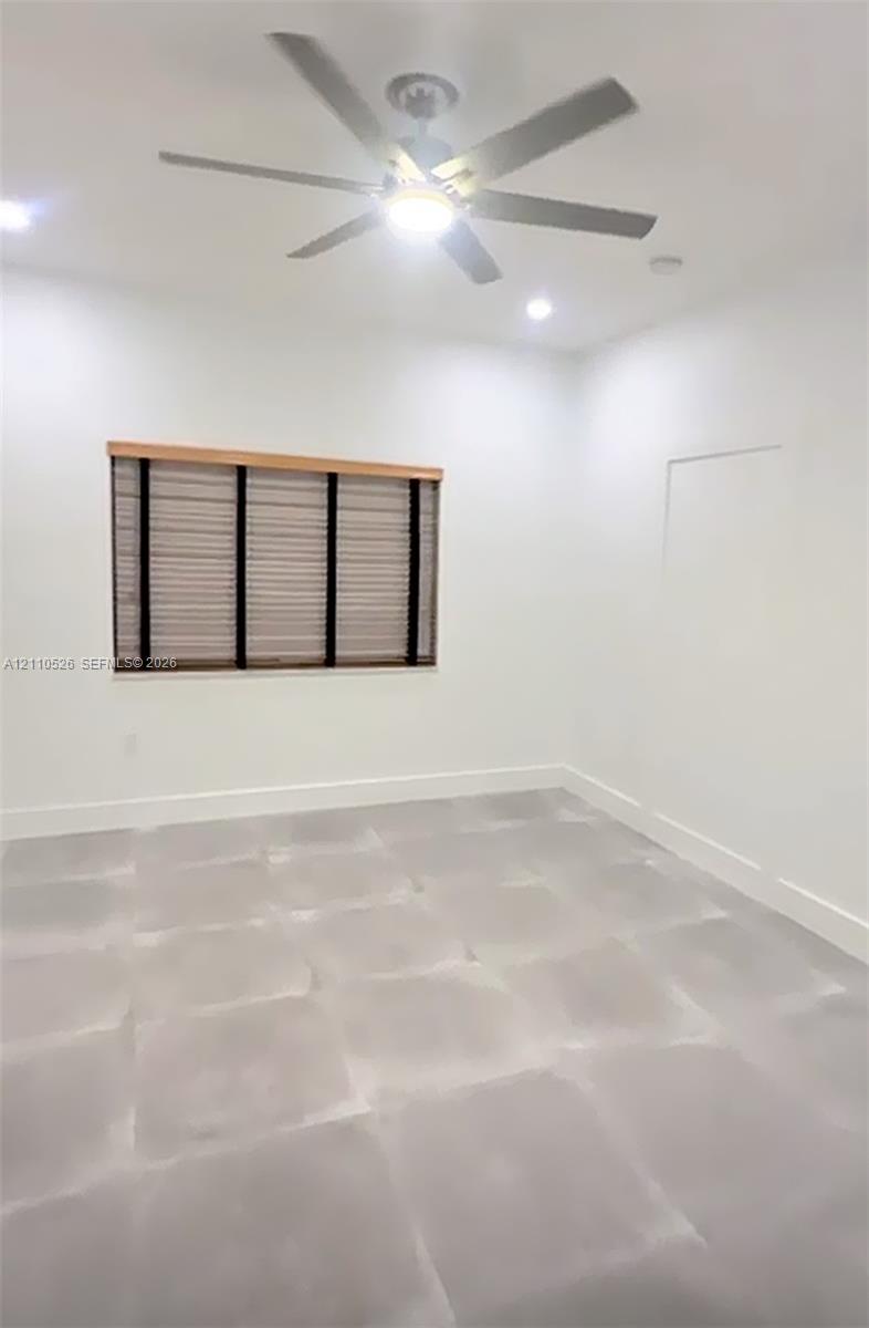 Neutral-toned tile flooring, recessed ceiling lighting, and a multi-blade ceiling fan featuring an integrated light fixture Neutral-toned tile flooring, recessed ceiling lighting, and a multi-blade ceiling fan featuring an integrated light fixture