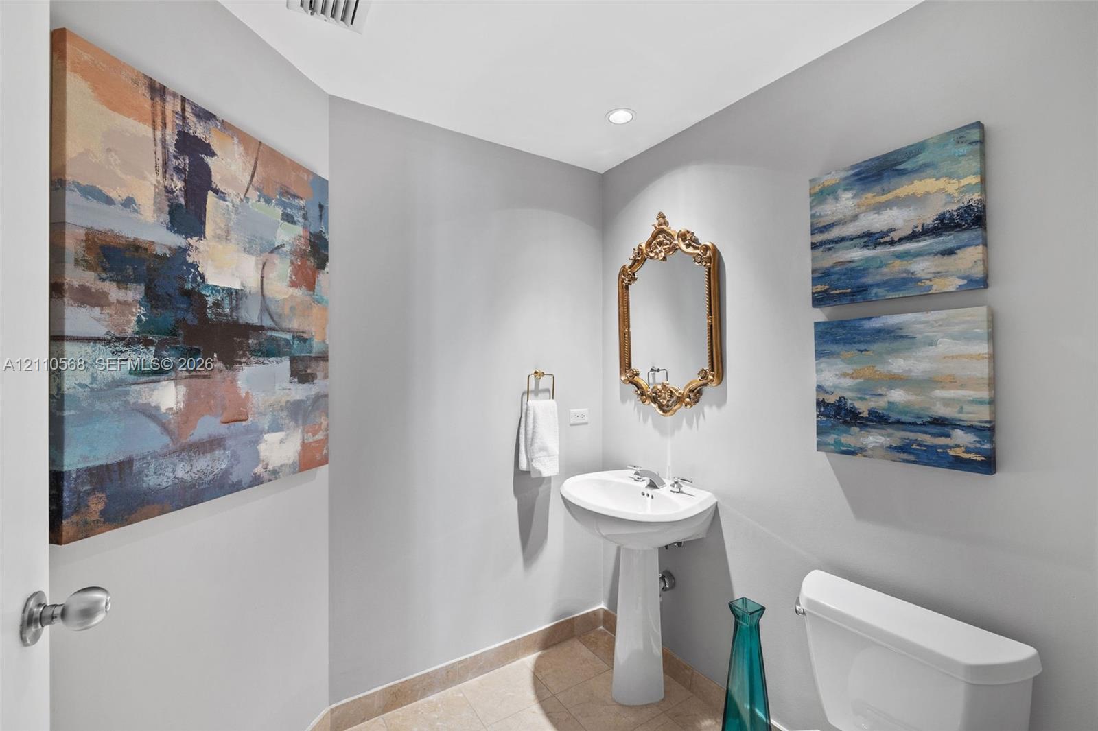 Pedestal sink with polished chrome faucet, tile flooring, and recessed lighting