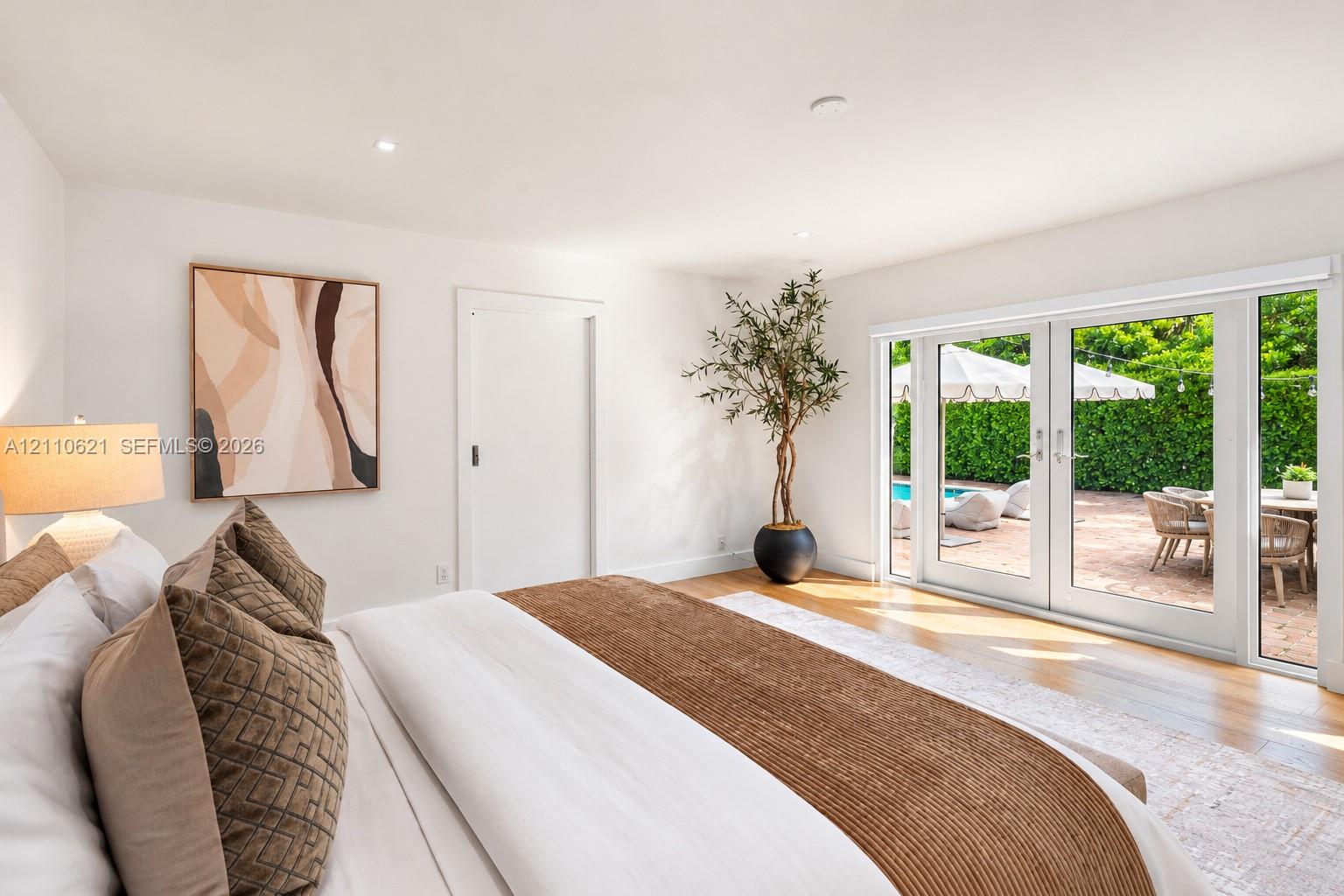 Interior featuring wood-finish flooring, recessed lighting, and double glass doors with sidelights