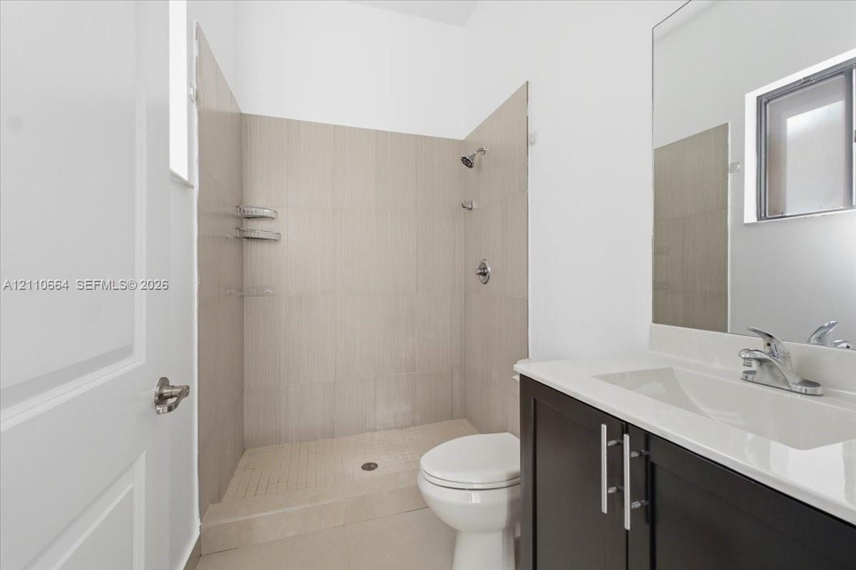 Versatile first-floor bedroom with a private full bathroom, ideal for guests or a home office.