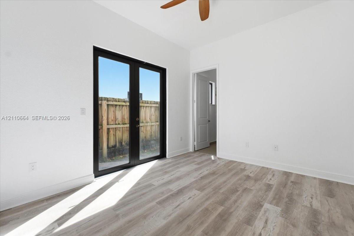 Versatile 1st floor bedroom with a private full bathroom, ideal for guests or a home office.