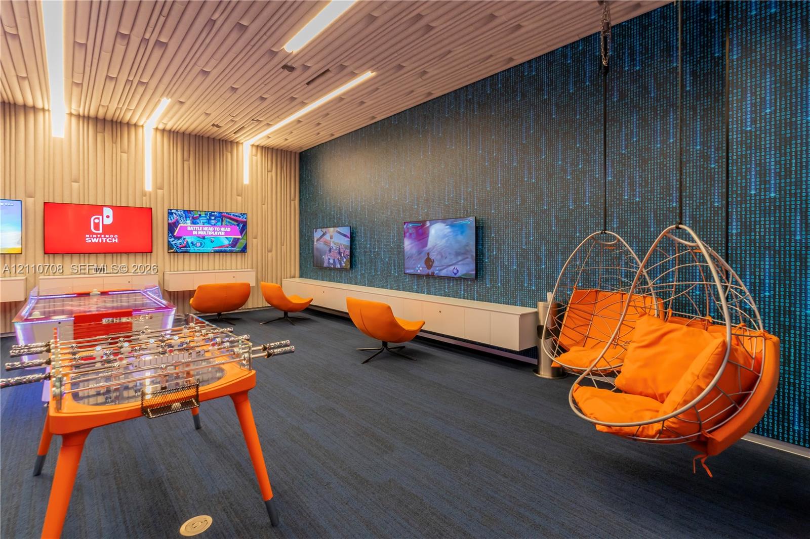 Textured ceiling paneling with integrated recessed lighting, custom floating cabinetry, and decorative accent wall surfacing Textured ceiling paneling with integrated recessed lighting, custom floating cabinetry, and decorative accent wall surfacing