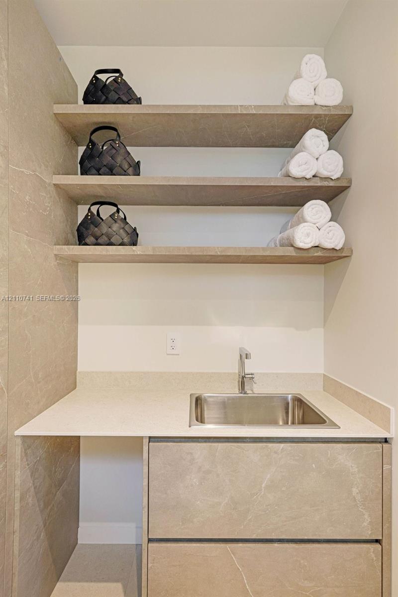 laundry room with built in cabinetry