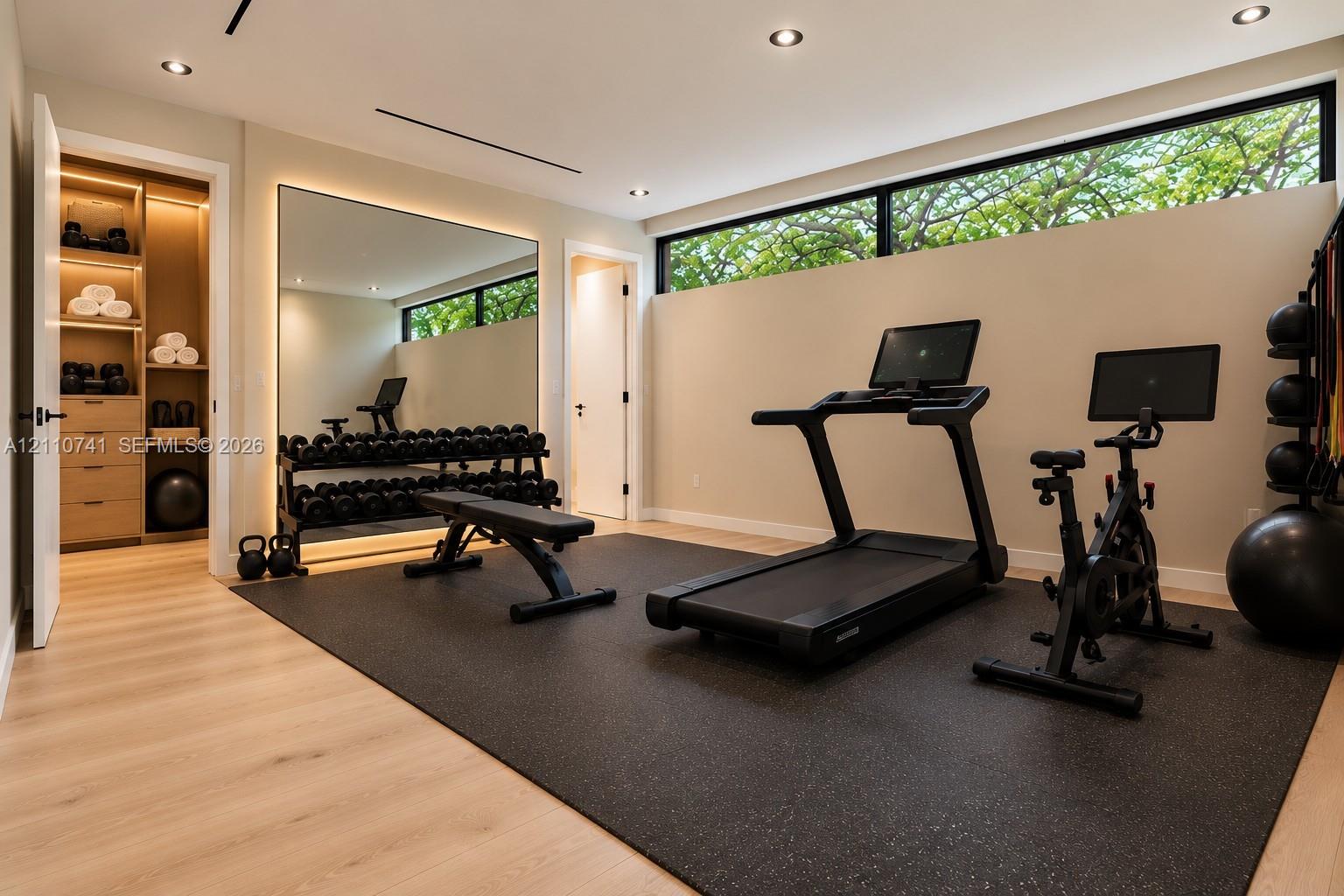 bedroom with en-suite/ gym virtually staged for illustrative purposes