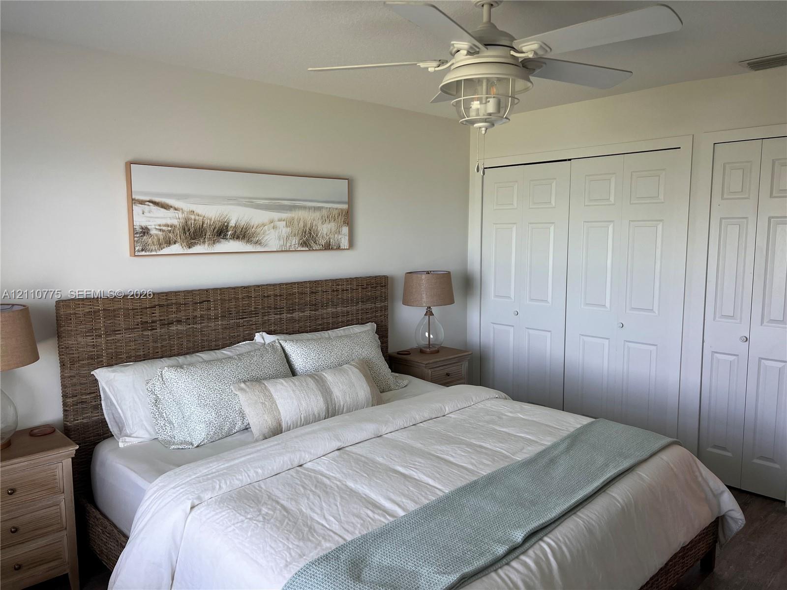 Ceiling-mounted light fixture with an integrated fan and dual-panel closet doors