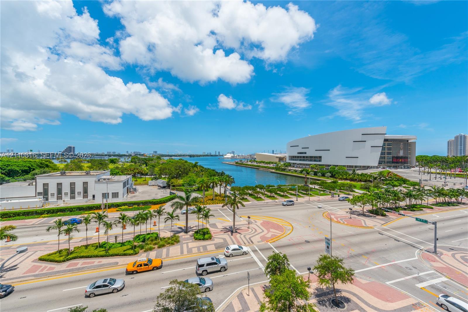 Elevated perspective of the surrounding urban landscape, waterfront proximity, and expansive sky