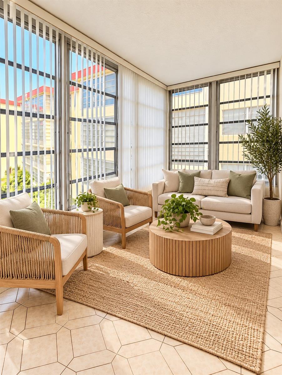 STAGED Sunroom featuring expansive floor-to-ceiling windows, vertical blinds, and geometric-patterned tile flooring STAGED Sunroom featuring expansive floor-to-ceiling windows, vertical blinds, and geometric-patterned tile flooring