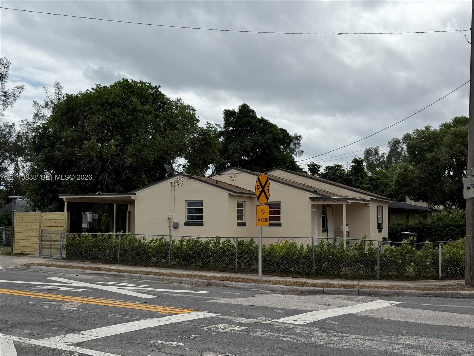 Charming single-story residence featuring a covered front porch, horizontal siding exterior, and multiple windows providing natural light Charming single-story residence featuring a covered front porch, horizontal siding exterior, and multiple windows providing natural light