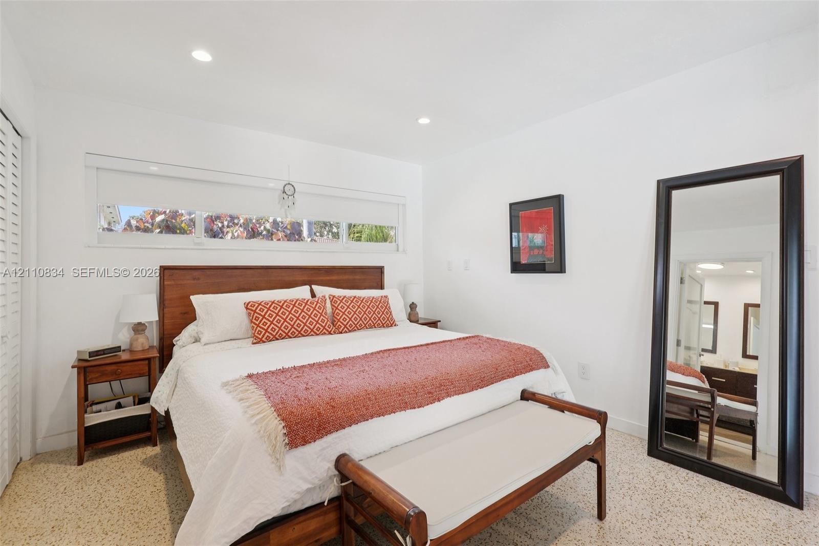 Bedroom featuring recessed lighting, horizontally oriented clerestory windows, and light-toned terrazzo flooring