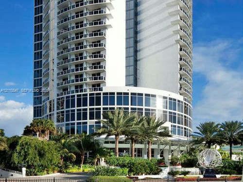 High-rise tower featuring a glass facade, floor-to-ceiling windows, and private wrap-around balconies High-rise tower featuring a glass facade, floor-to-ceiling windows, and private wrap-around balconies