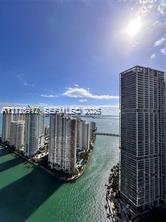 High-rise urban landscape featuring waterfront property, prominent high-rise architecture, and expansive marine frontage