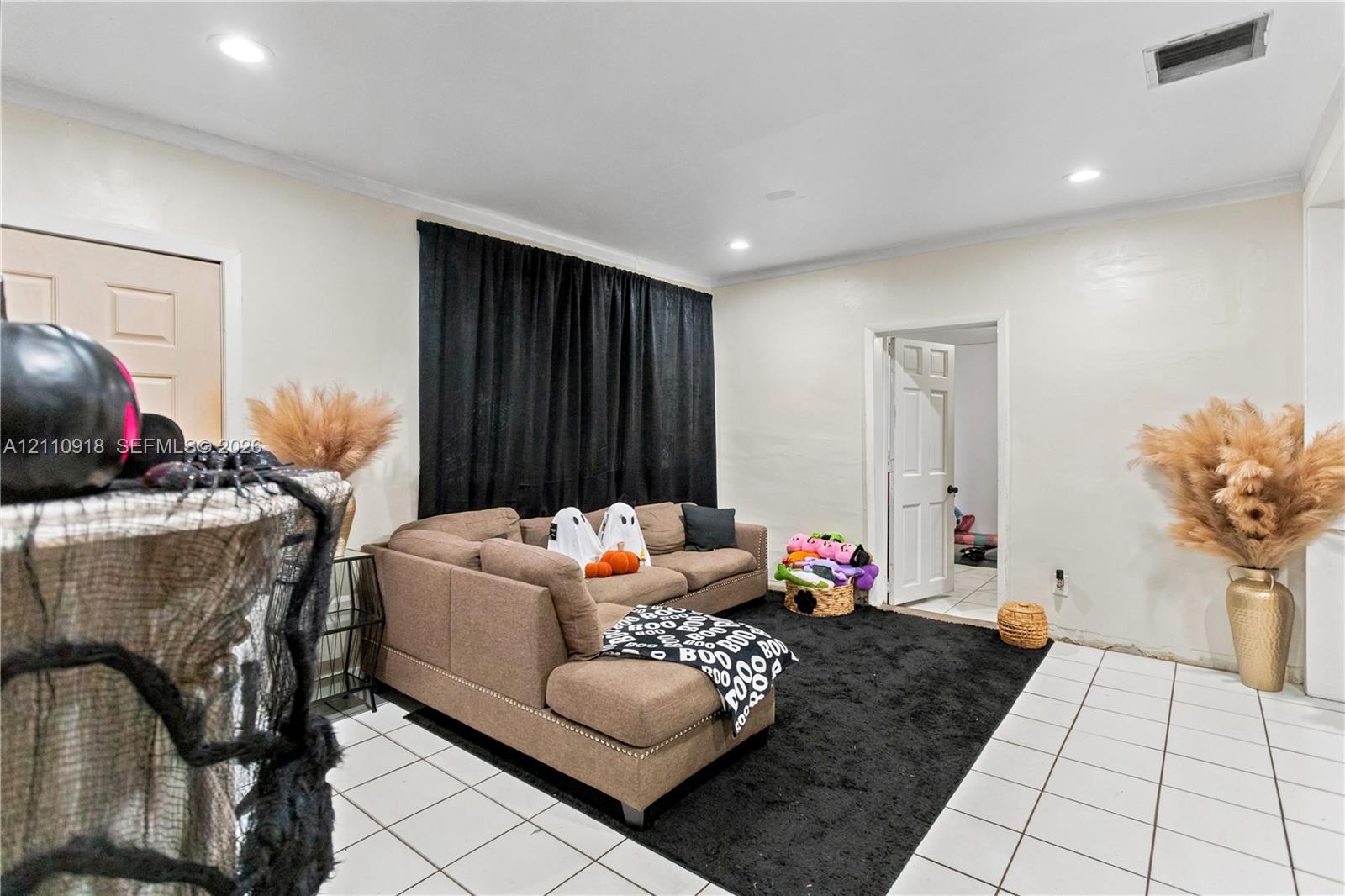 Interior space featuring recessed lighting, white tile flooring, and solid-core interior doors