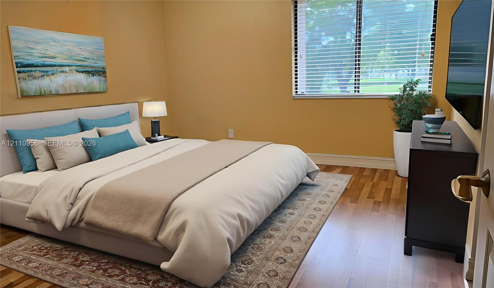 Wood-finish flooring and a multi-pane window with horizontal blinds