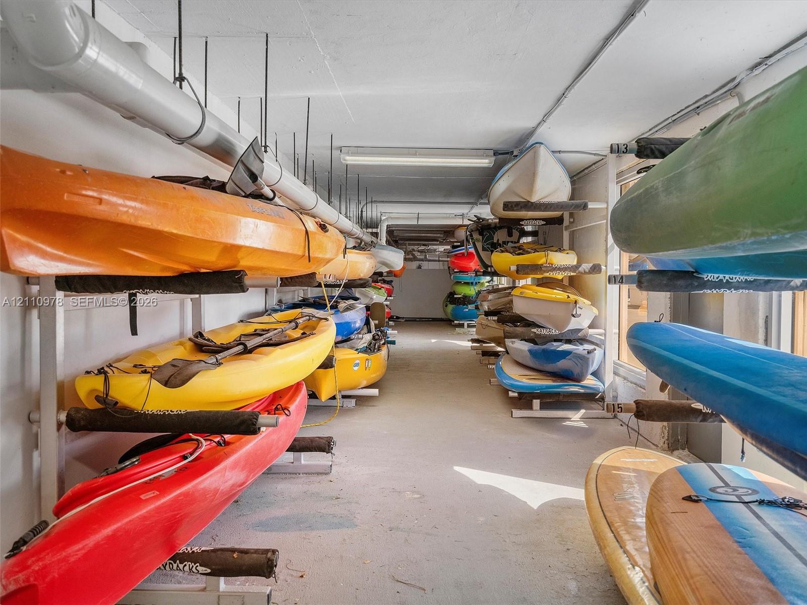Dedicated storage area featuring multi-level metal racking systems for watercraft