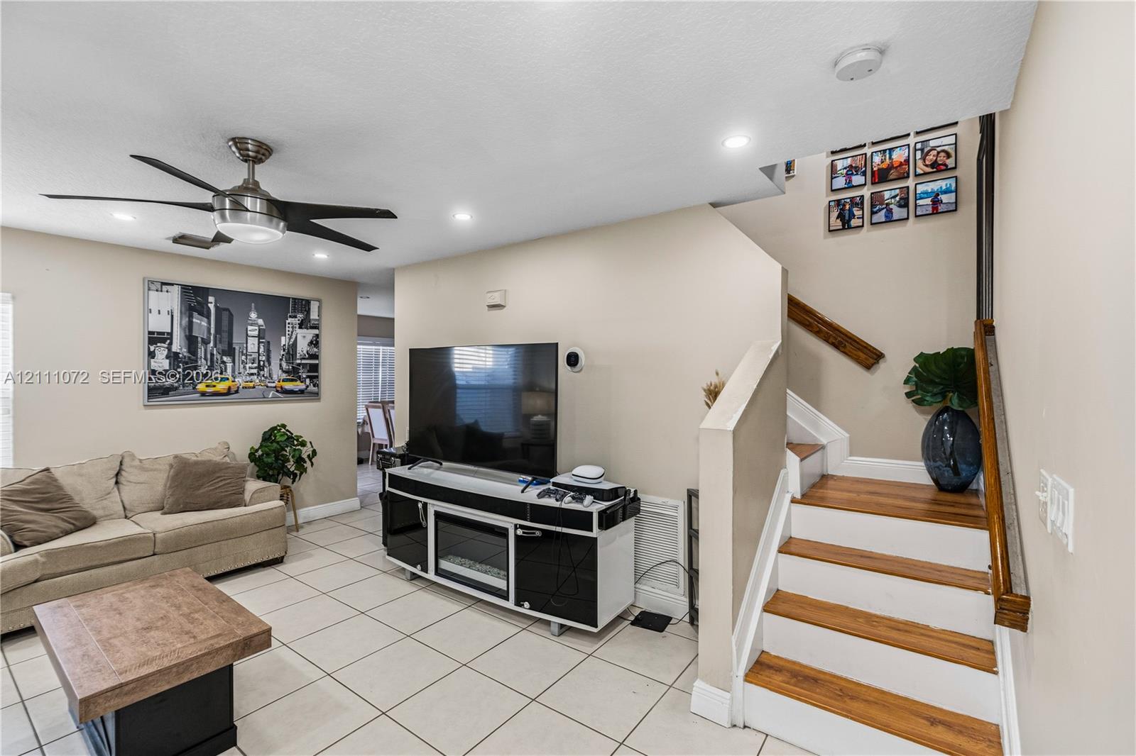 Interior space featuring large-format ceramic floor tile, recessed lighting, and a modern ceiling fan