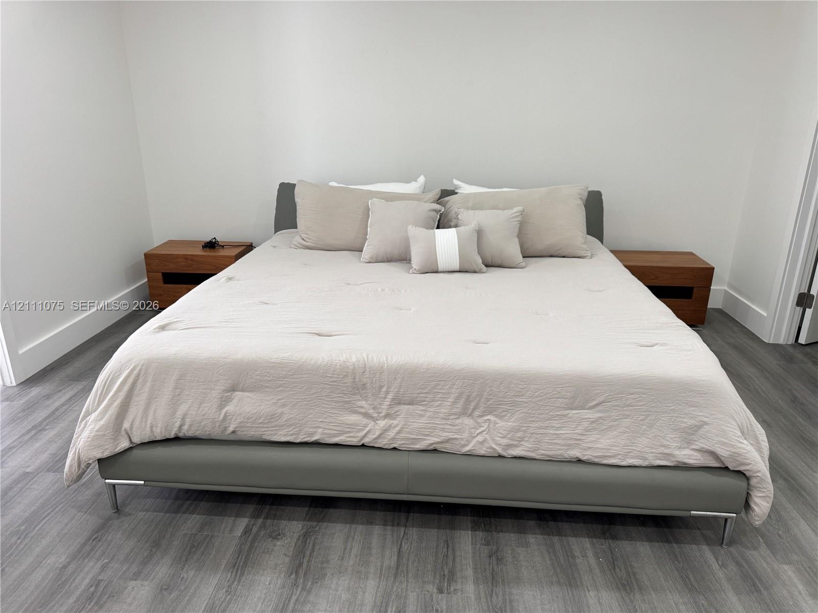 Wood-finish flooring throughout with neutral wall tones