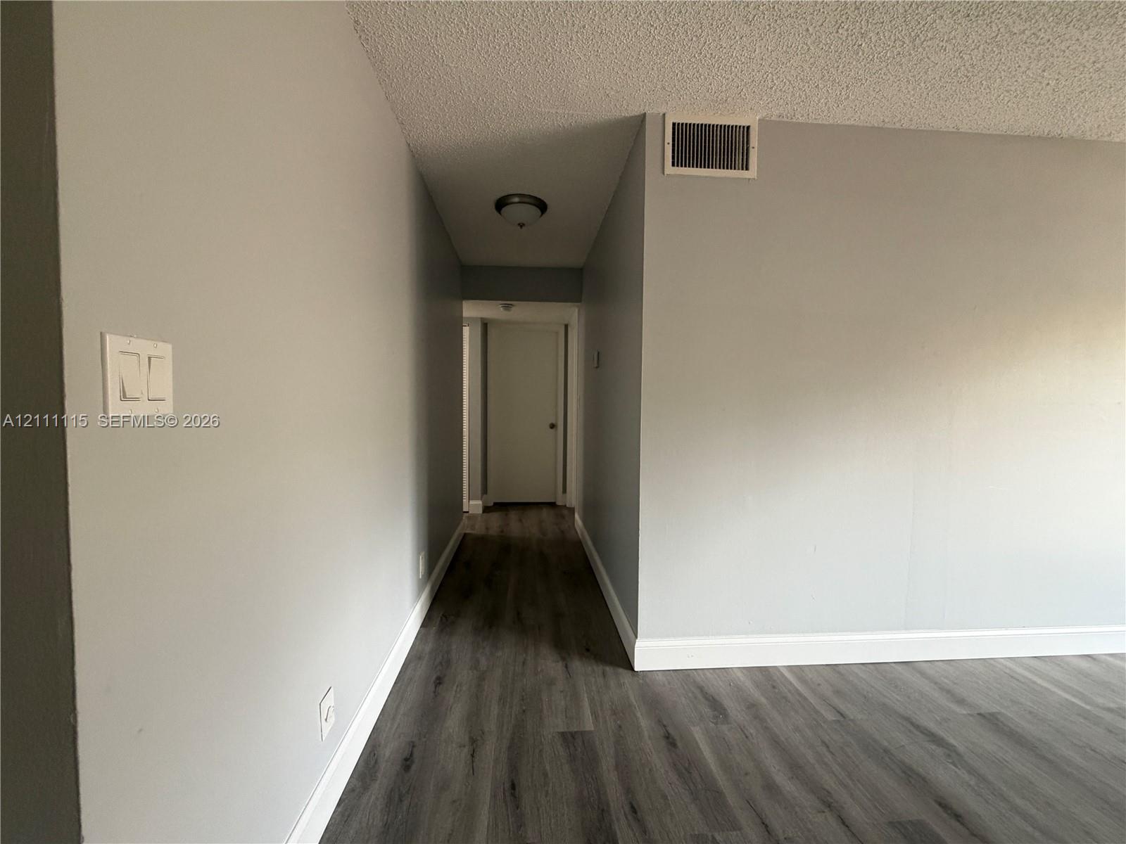 Hall way to the Bedrooms & Bathroom