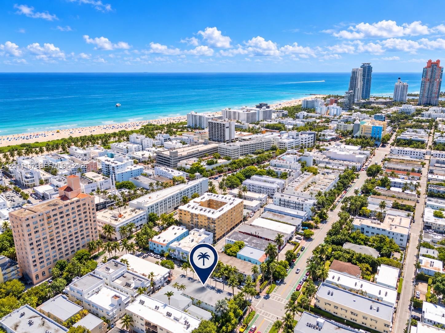 Aerial perspective featuring close proximity to the coastline, expansive ocean scenery, and a dense urban grid