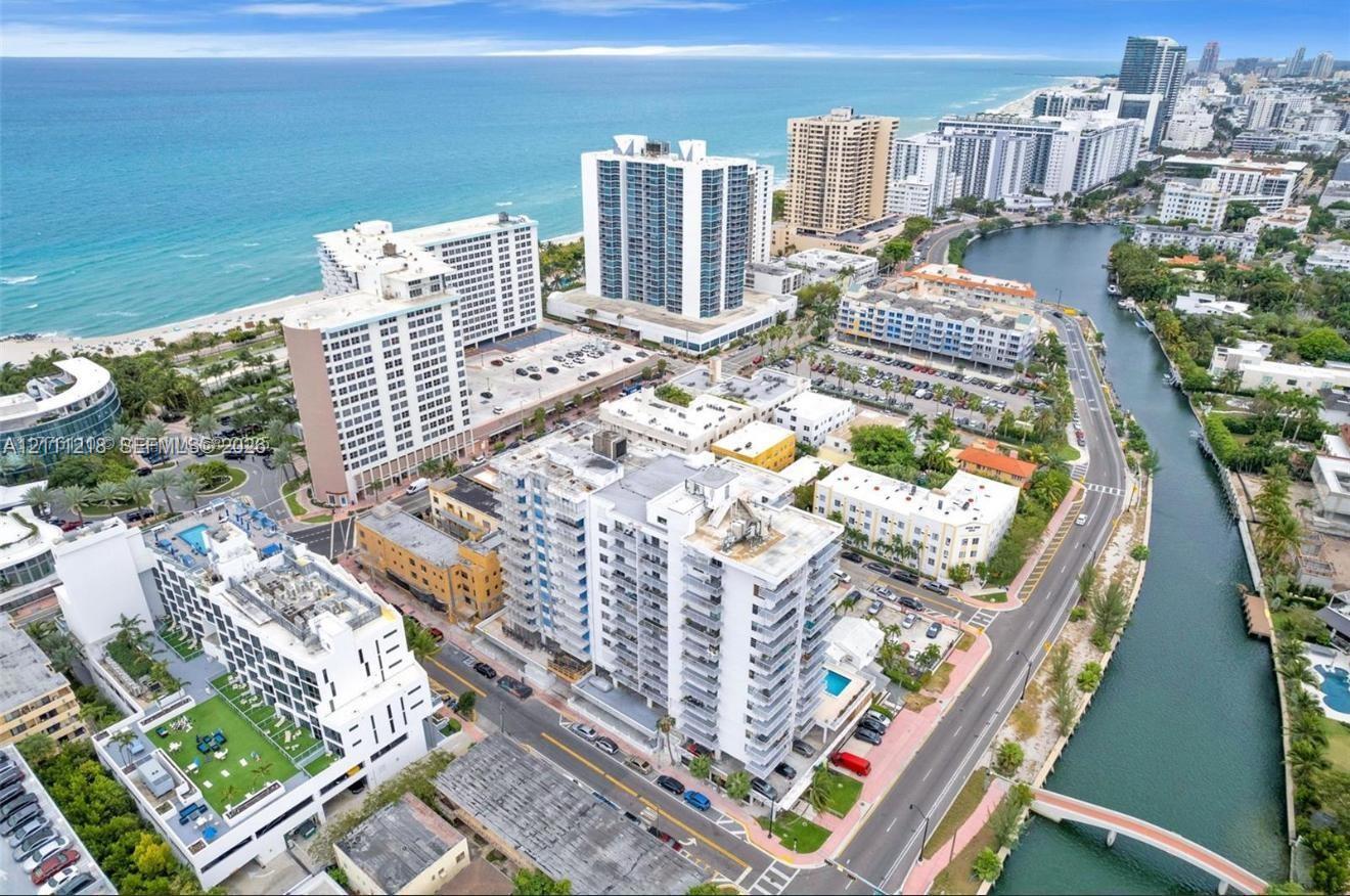 Aerial perspective featuring a coastal location with access to the Atlantic Ocean and a waterway, positioned within a high-density urban environment