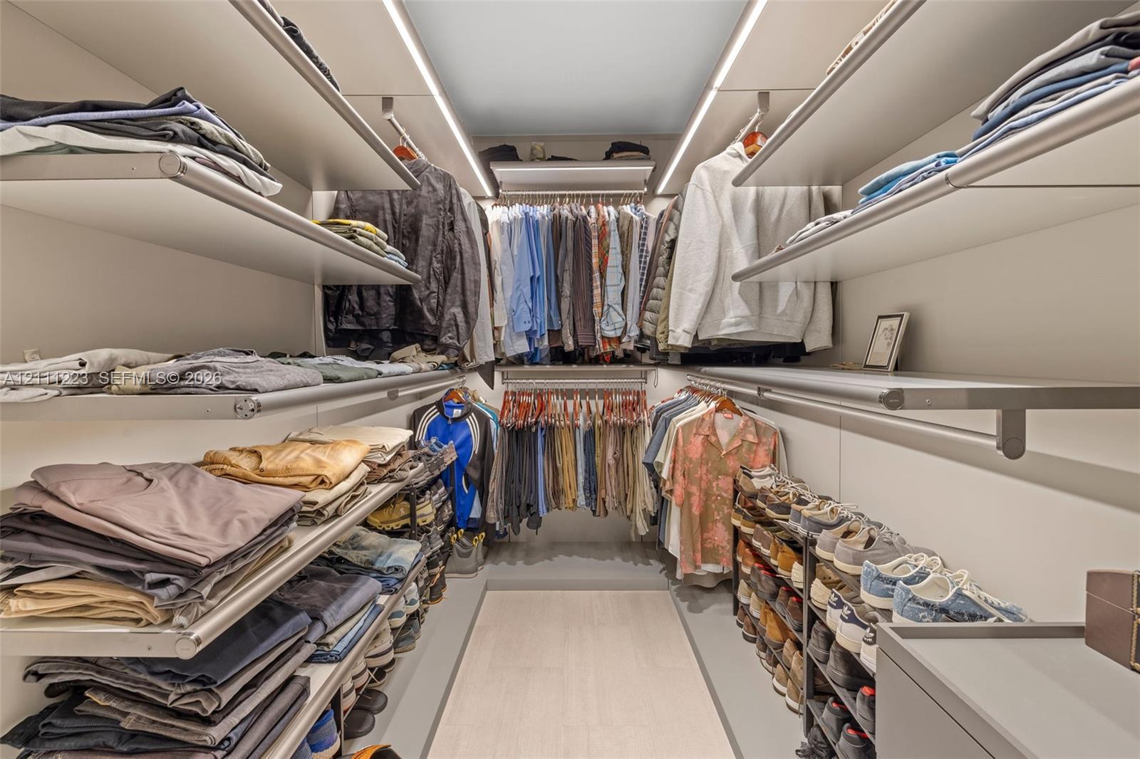 Den converted into custom walk-in closet for primary