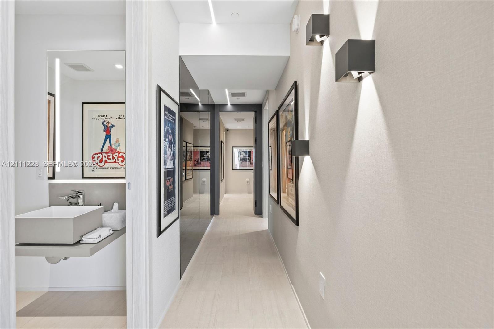 Hallway leading to guest bath, primary room & 2nd bedroom