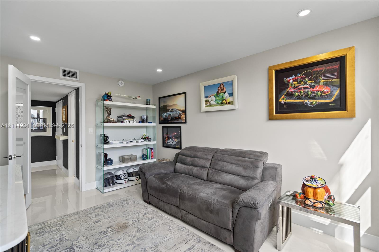Neutral interior space featuring polished tile flooring, recessed lighting, and a neutral wall color palette