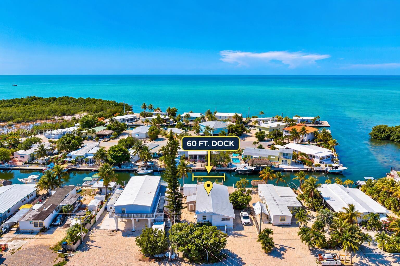 Waterfront property featuring a 60-foot private dock and canal access