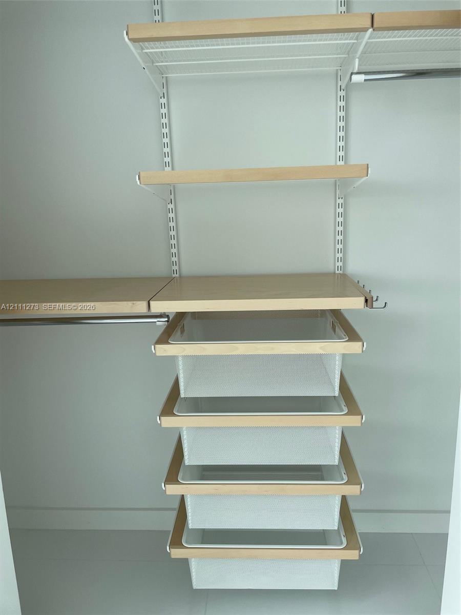 Customized closet in the second bedroom.