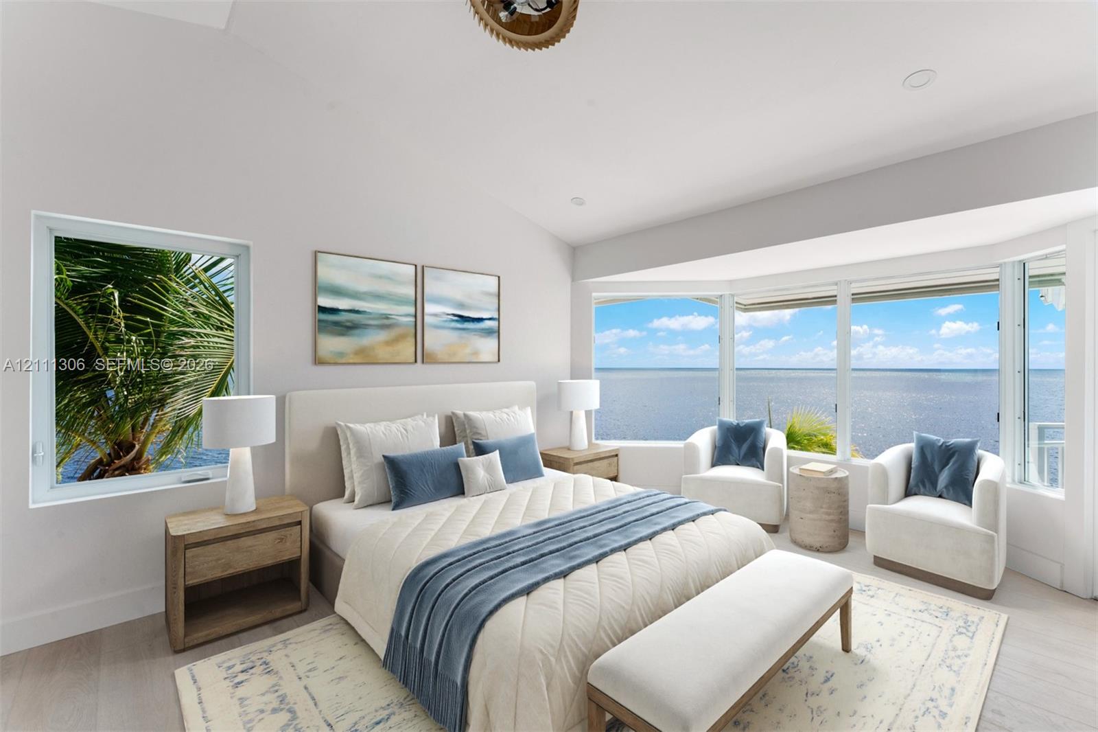 Vaulted ceilings, expansive bay windows, and light-toned wood-finish flooring