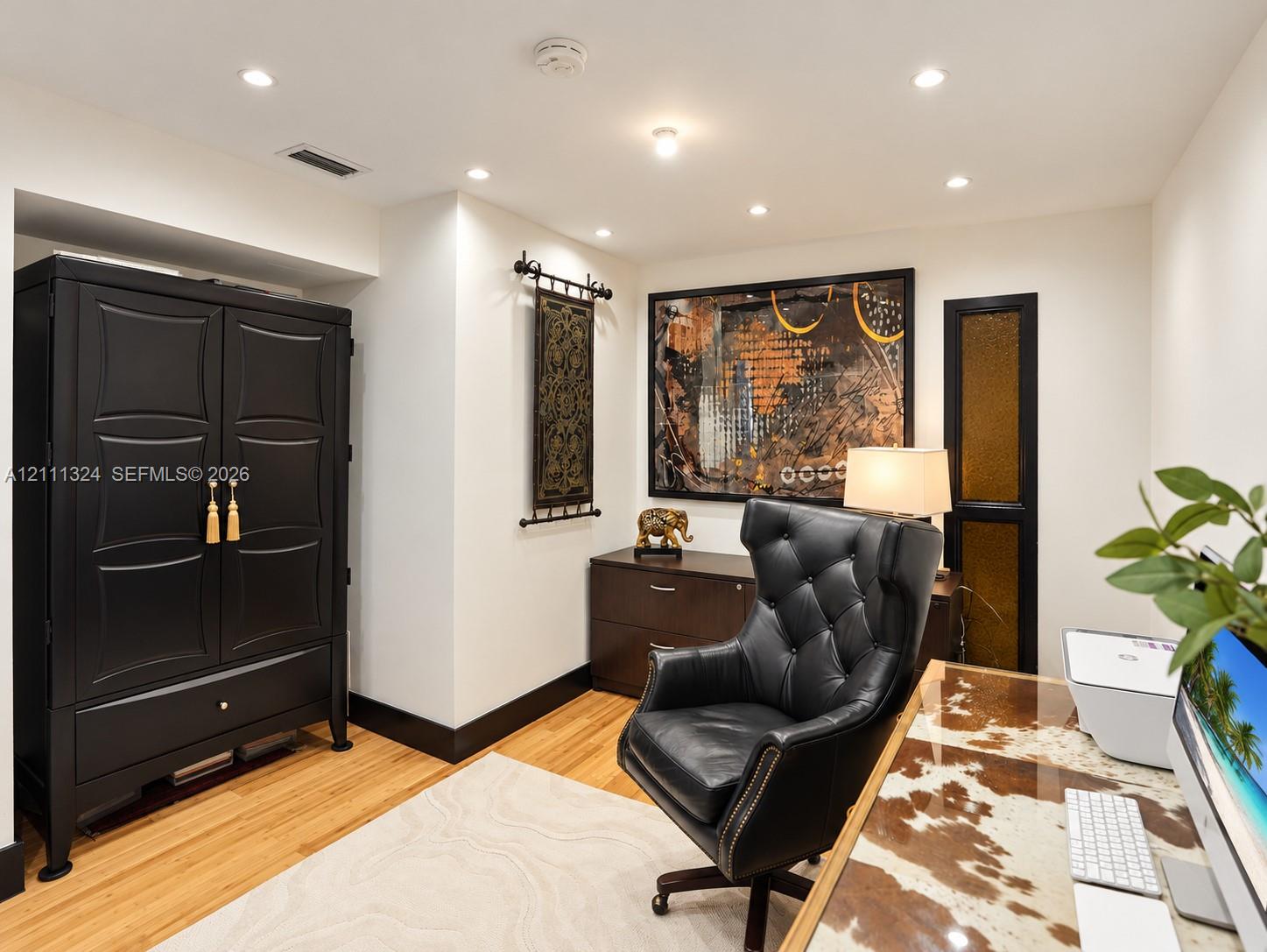 Recessed lighting and wood-finish flooring