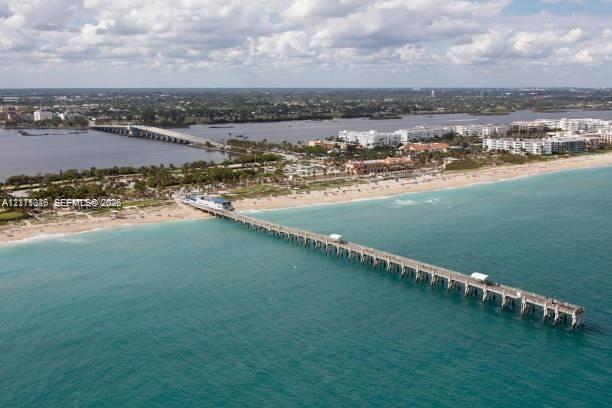 Aerial perspective featuring coastal Lake Worth Beach and pier.